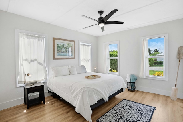 bedroom with hardwood / wood-style flooring and ceiling fan