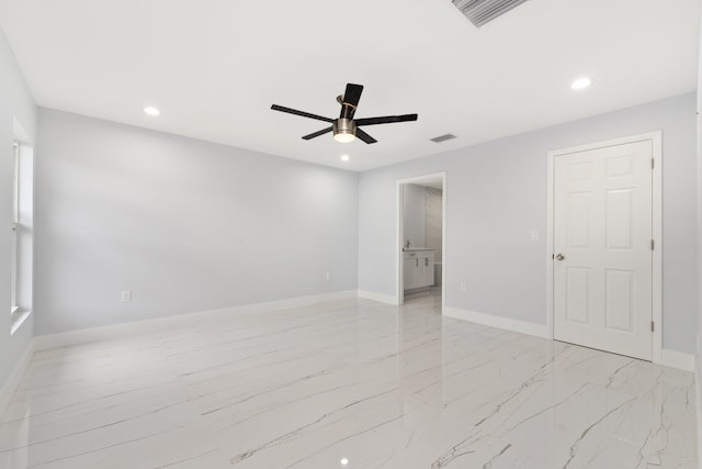 spare room with ceiling fan