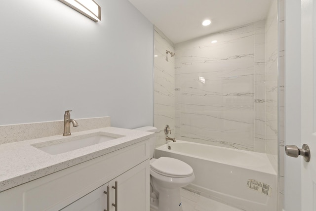 full bathroom featuring vanity, toilet, and tiled shower / bath combo