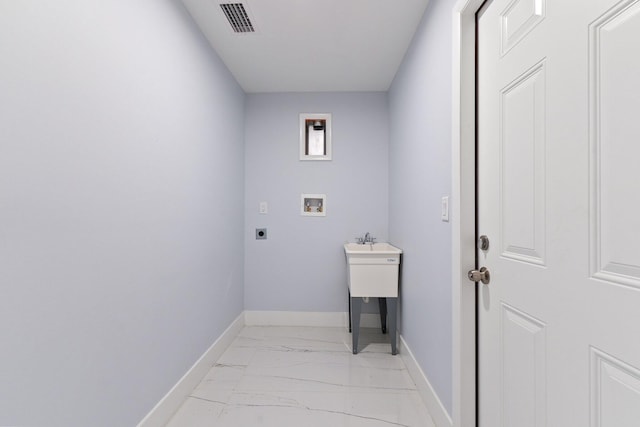 clothes washing area with washer hookup and hookup for an electric dryer