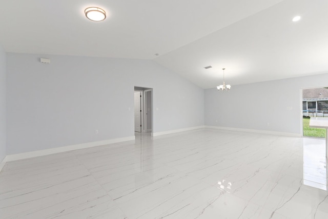 unfurnished room with a notable chandelier and vaulted ceiling