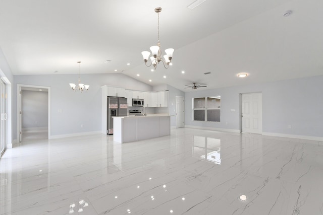 unfurnished living room with ceiling fan with notable chandelier and lofted ceiling