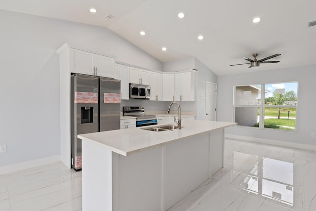 kitchen featuring appliances with stainless steel finishes, sink, white cabinetry, lofted ceiling, and ceiling fan