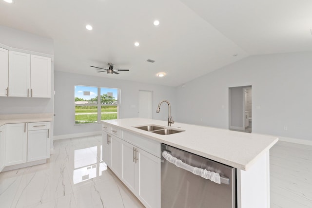 kitchen featuring dishwasher, an island with sink, sink, ceiling fan, and lofted ceiling