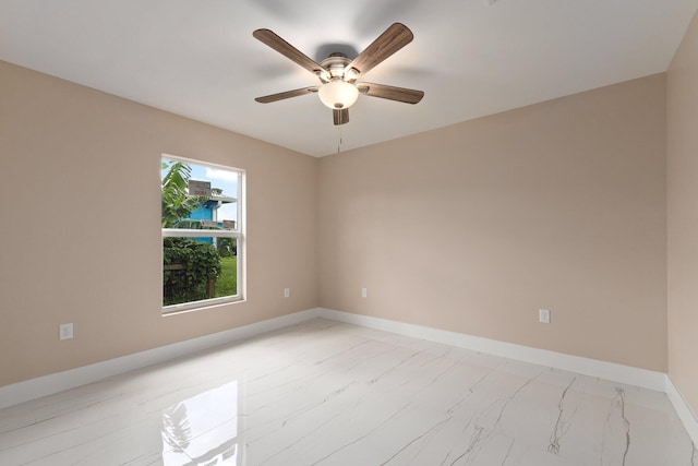 spare room with ceiling fan