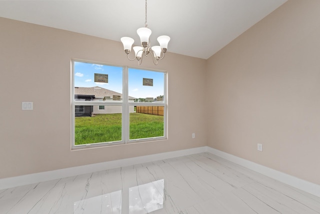 empty room featuring vaulted ceiling and an inviting chandelier