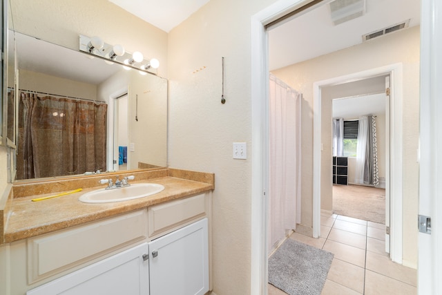 bathroom with vanity and tile patterned floors