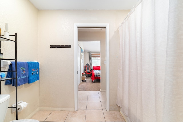 hallway with light tile patterned flooring