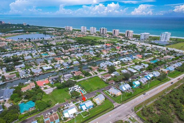 birds eye view of property with a water view