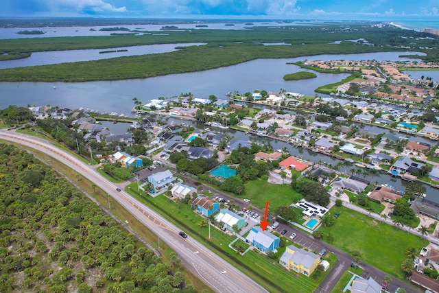 birds eye view of property with a water view