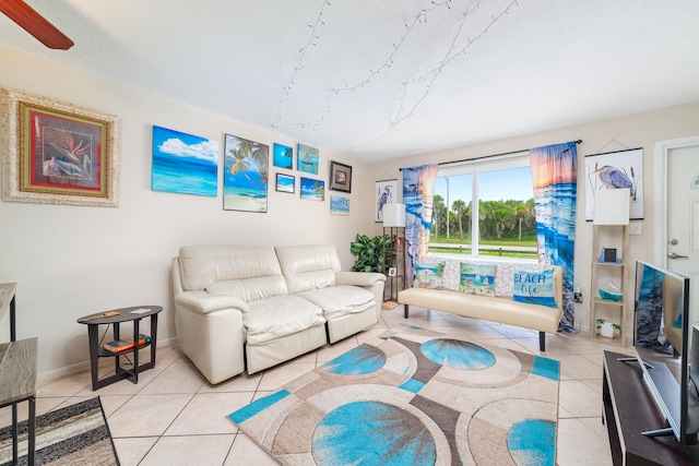 tiled living room with ceiling fan