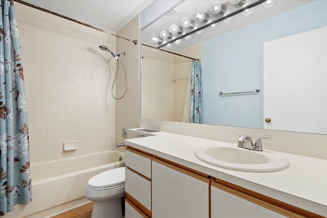 full bathroom featuring vanity, toilet, and shower / bath combo with shower curtain