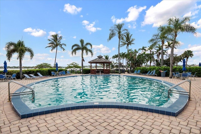 view of swimming pool with a gazebo and a patio area