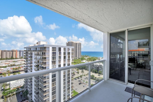 balcony featuring a water view