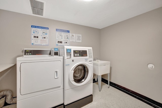 laundry area featuring independent washer and dryer