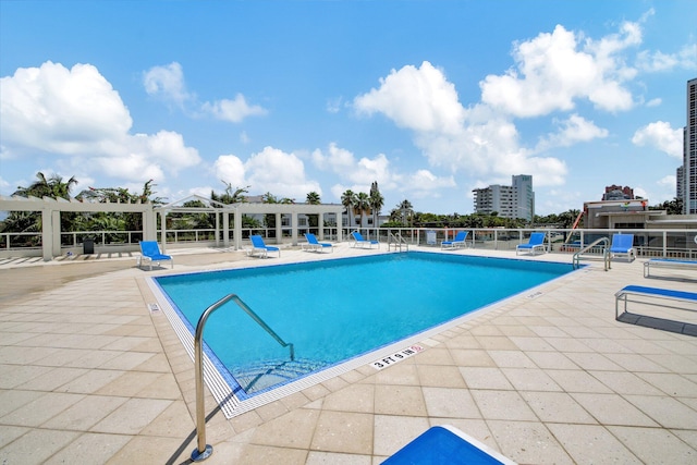 view of pool featuring a patio