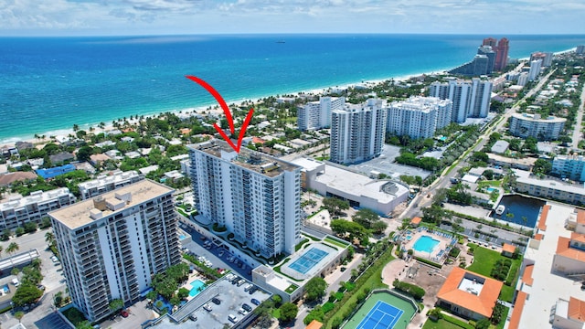 bird's eye view featuring a view of the beach and a water view