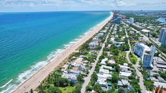 aerial view featuring a view of the beach and a water view