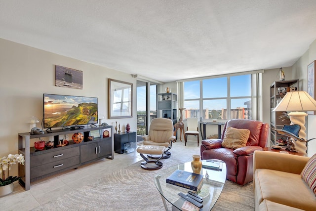 living room with light tile patterned flooring, a textured ceiling, and a healthy amount of sunlight