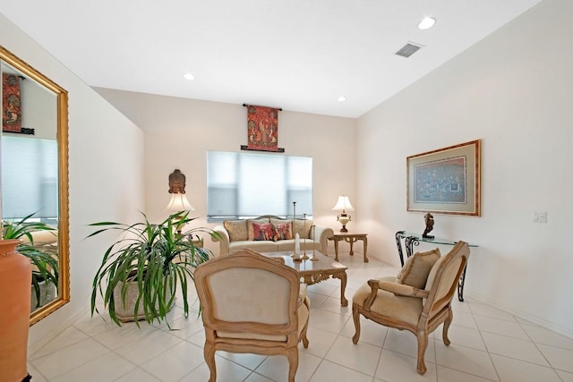 living area with baseboards, light tile patterned flooring, visible vents, and recessed lighting