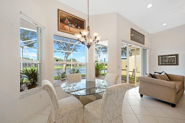 dining area with light tile patterned floors, recessed lighting, and an inviting chandelier