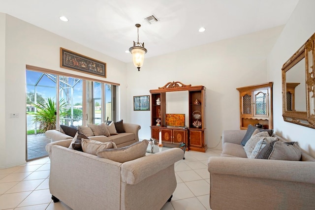 living area featuring light tile patterned floors, visible vents, and recessed lighting