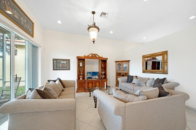 living room featuring light tile patterned floors, visible vents, a wealth of natural light, and recessed lighting