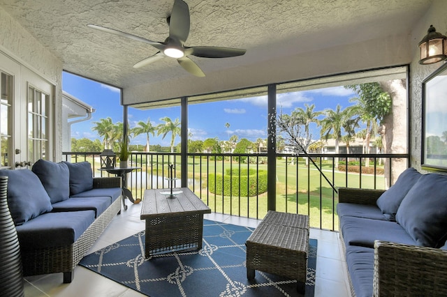 sunroom with plenty of natural light and ceiling fan