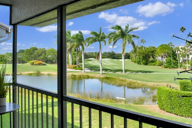 unfurnished sunroom featuring a water view