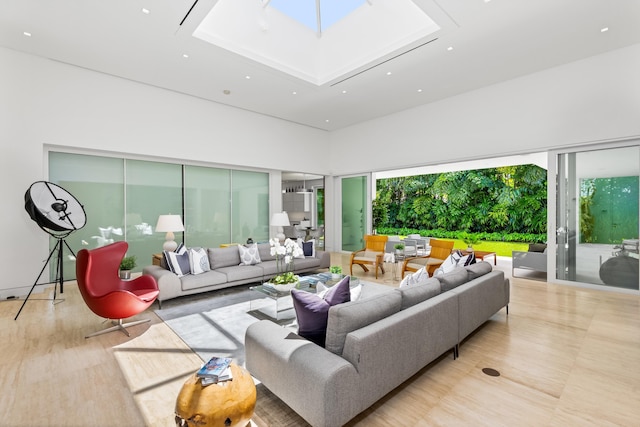 living room featuring a skylight and plenty of natural light