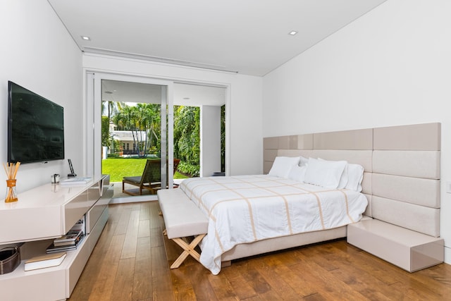 bedroom featuring hardwood / wood-style flooring and access to outside