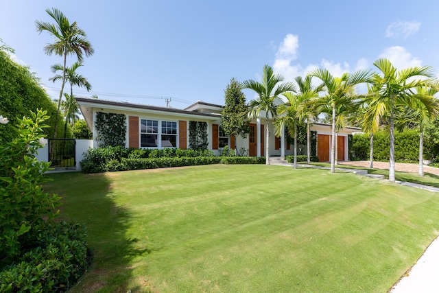 ranch-style house with a front lawn