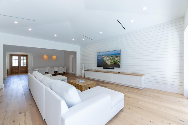 living room featuring light wood-type flooring and french doors