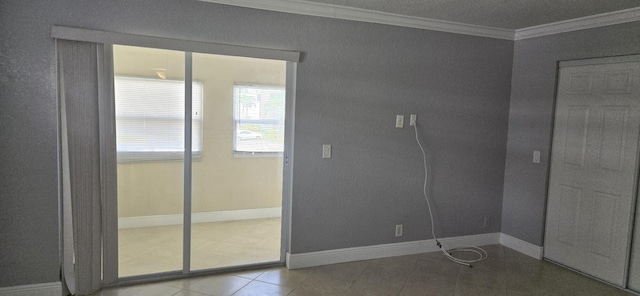 interior space featuring tile patterned floors and ornamental molding