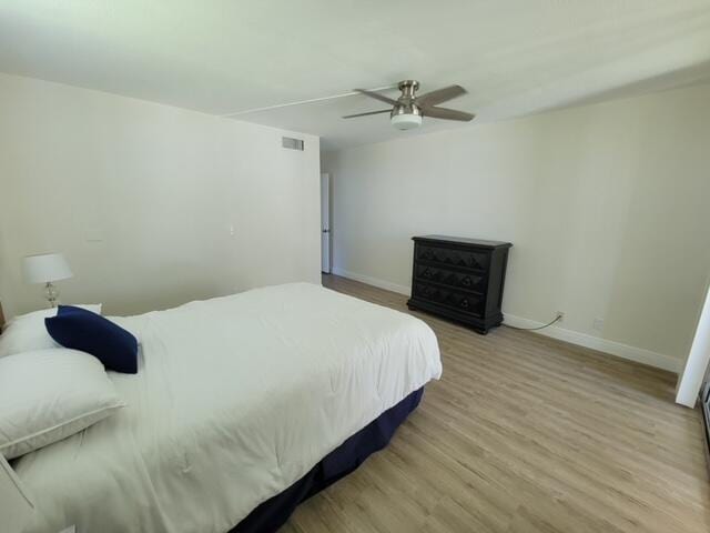 bedroom featuring hardwood / wood-style floors and ceiling fan