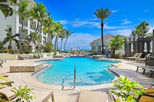 view of swimming pool featuring a patio area