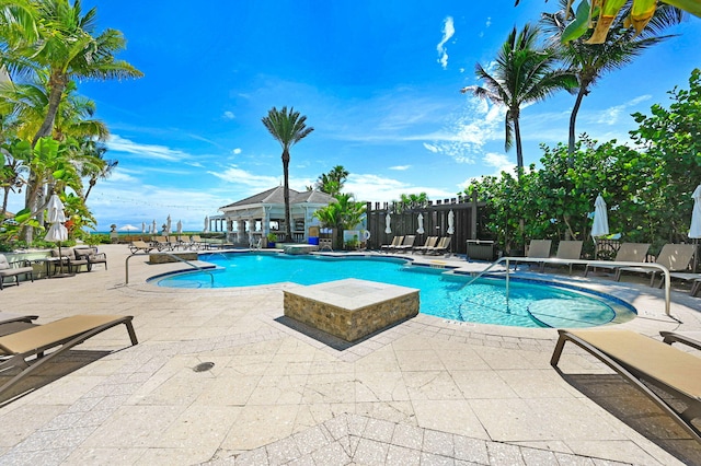 view of swimming pool featuring a patio area