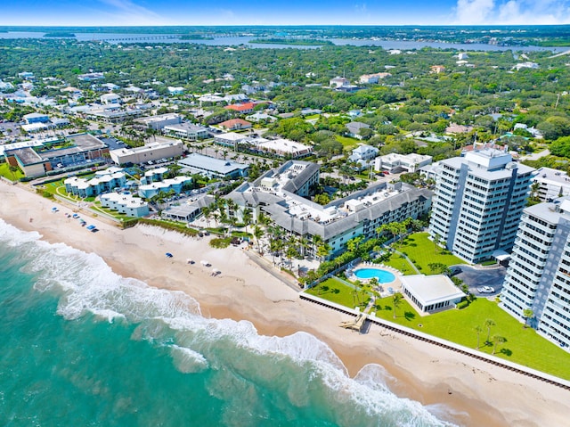 aerial view with a water view and a beach view