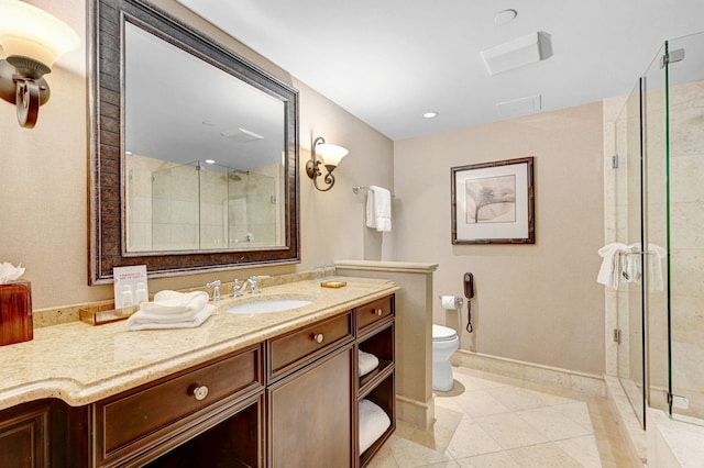 bathroom featuring vanity, toilet, tile patterned floors, and a shower with door