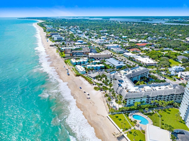 bird's eye view with a water view and a view of the beach