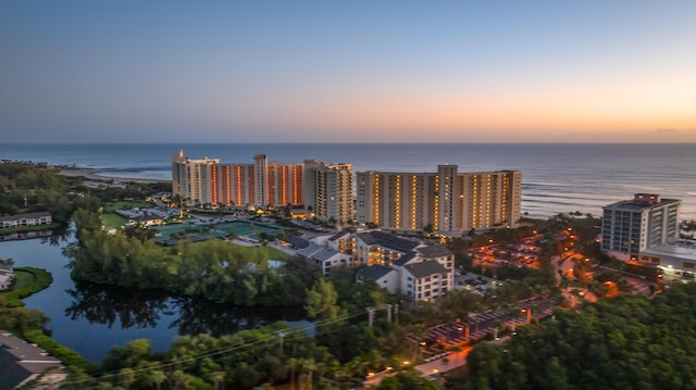 aerial view at dusk with a water view