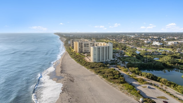 bird's eye view featuring a water view and a view of the beach