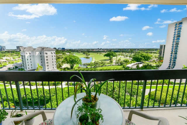 balcony featuring a water view