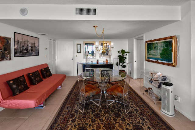 living room featuring a notable chandelier and tile patterned floors