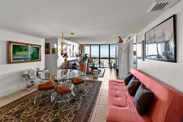 tiled living room featuring a wall of windows