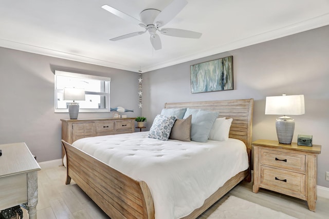 bedroom featuring ceiling fan, baseboards, and crown molding