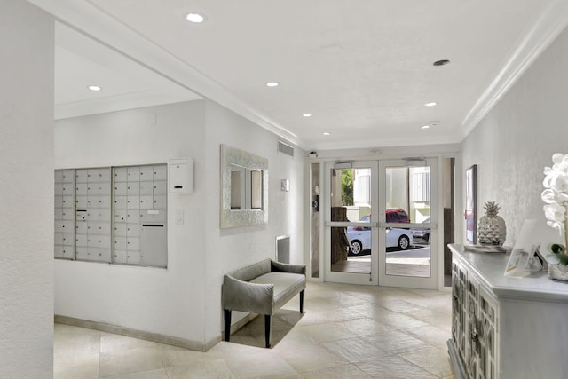 interior space with visible vents, baseboards, french doors, ornamental molding, and mail area