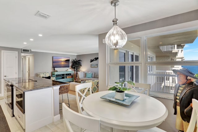 dining area featuring a notable chandelier, visible vents, crown molding, and recessed lighting