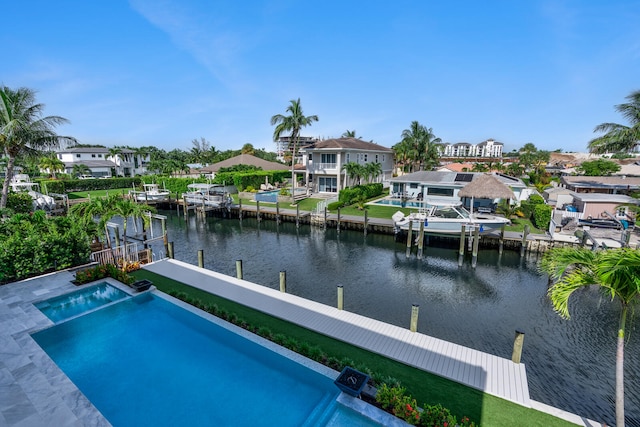 view of pool featuring a boat dock, a patio, and a water view