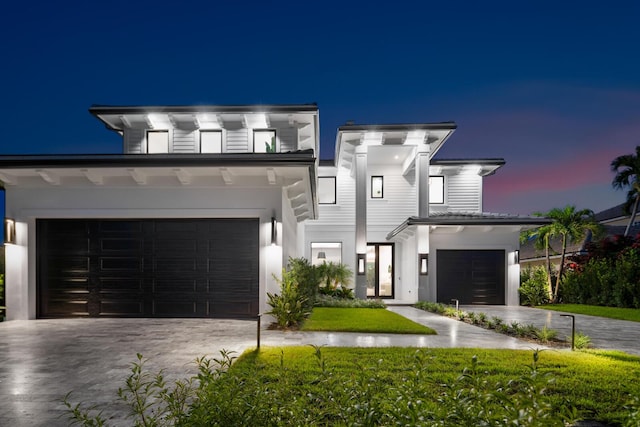 contemporary house with a front yard and driveway